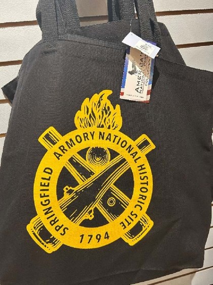 Picture of black cloth bag with yellow Ordnance emblem.  