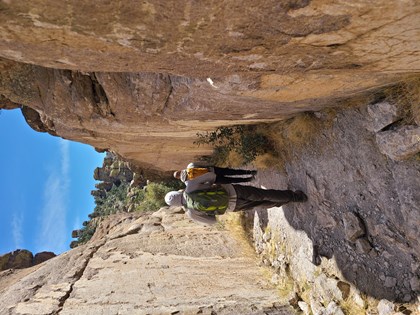 hiker between 2 narrow walls of rock