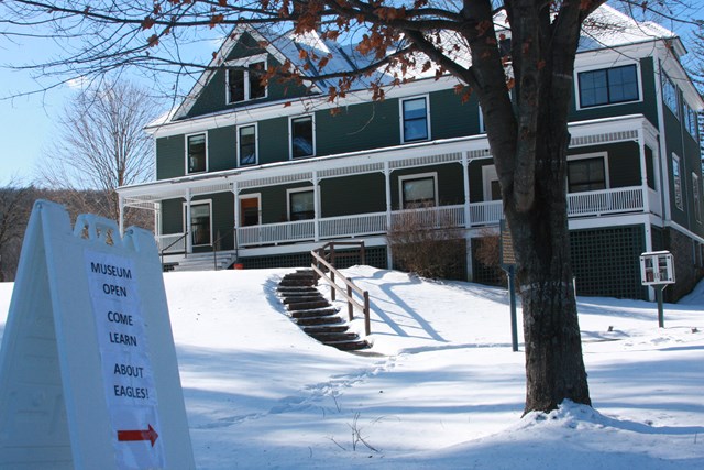 Zane Gray Museum covered in snow. Sign indicates museum is open.