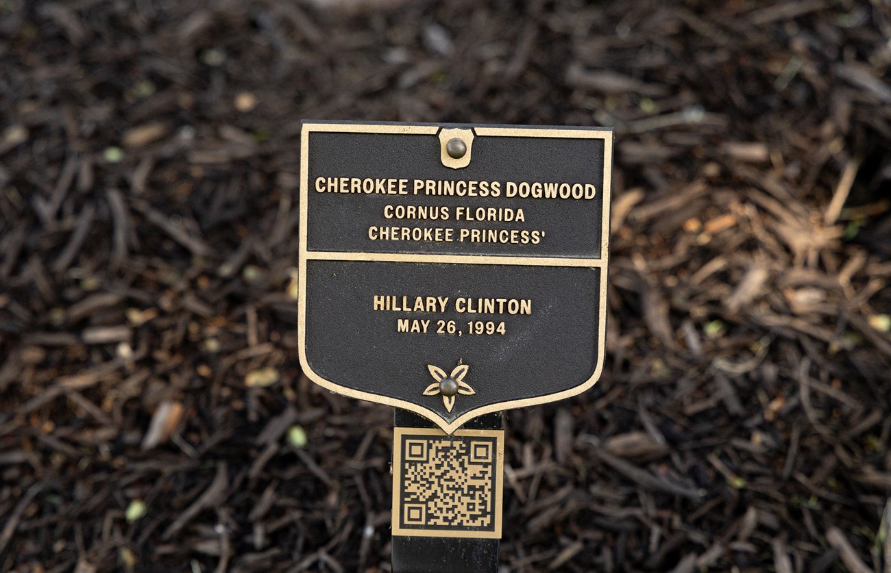 A plaque with a QR code underneath