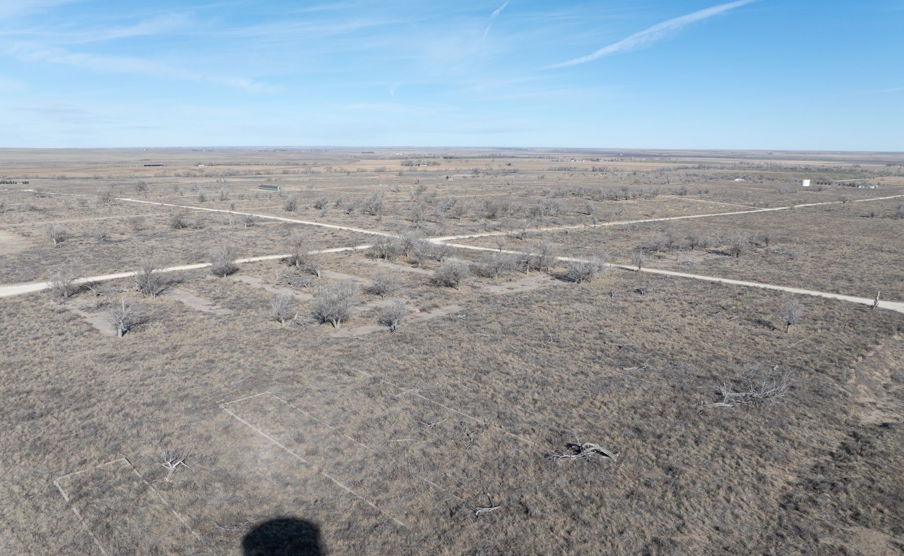 looking down on what appears to be a city with rows of army barracks