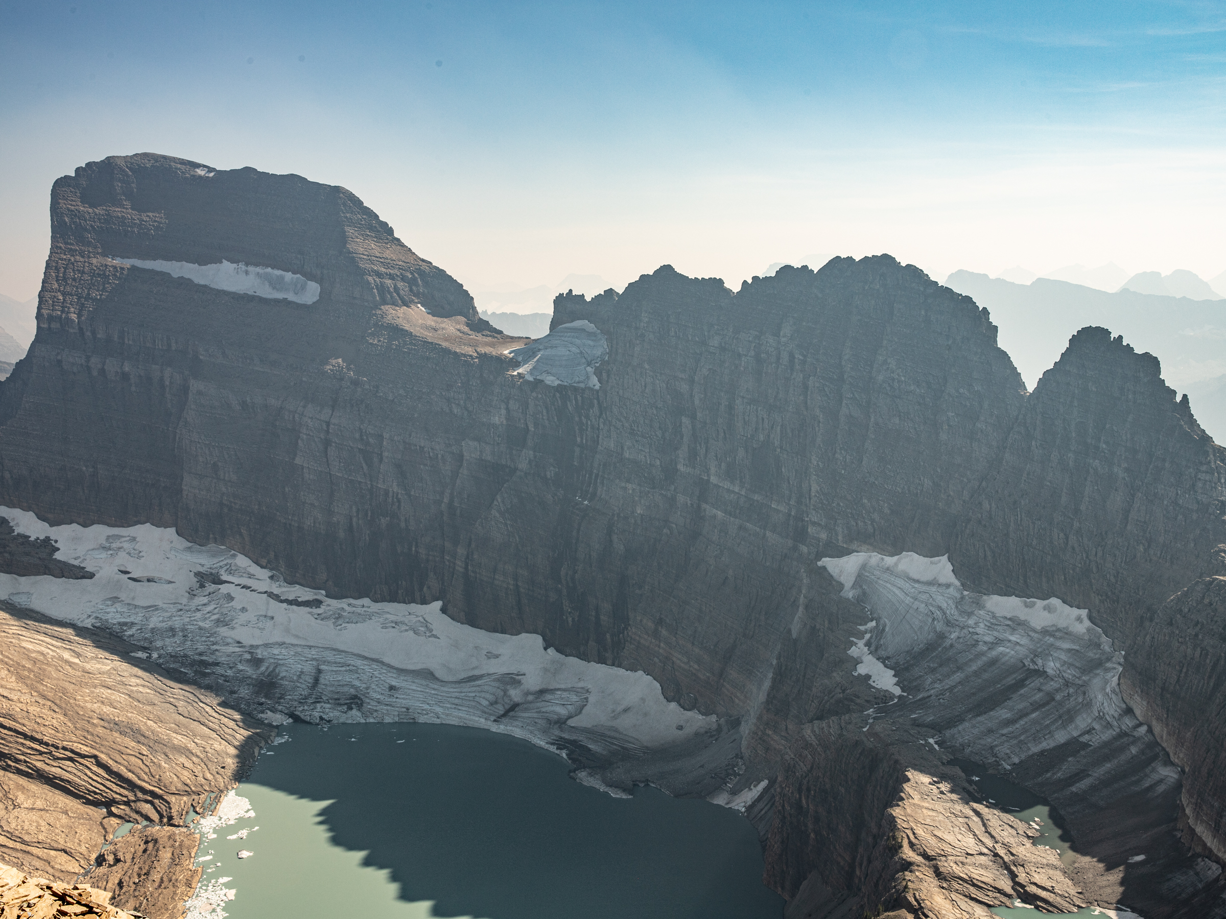 Landscape of an alpine glacier with mountains behind.