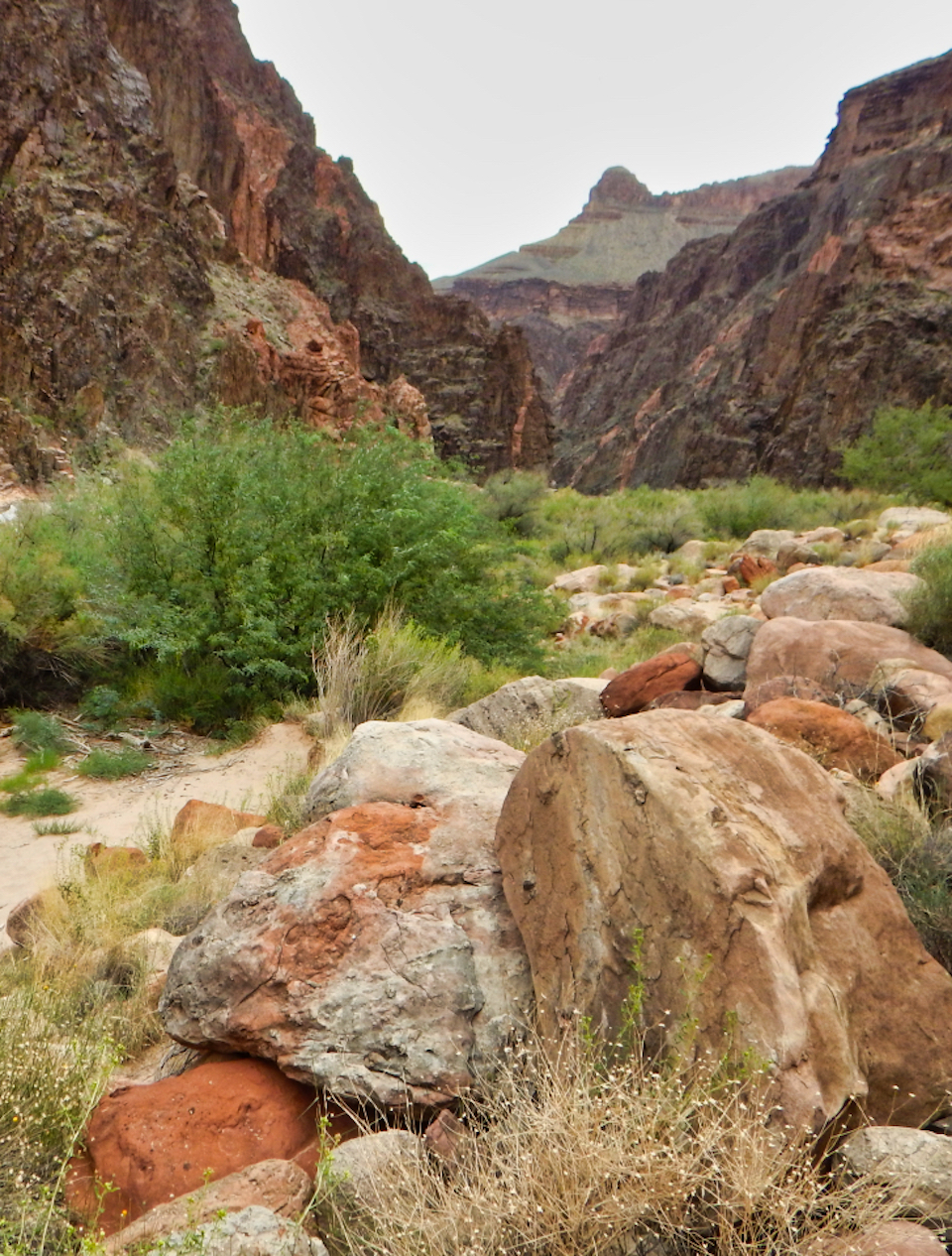 River canyon with boats and men