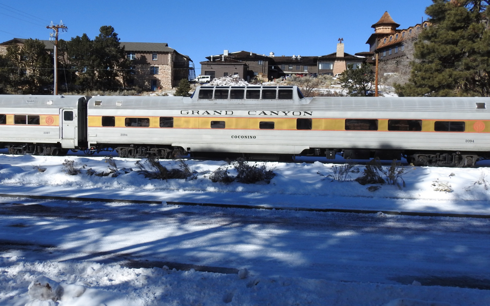 Train with buildings in background
