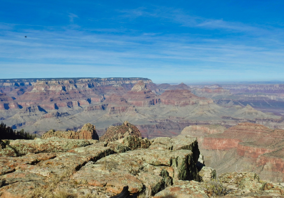 Historic car and driver on edge of cliff