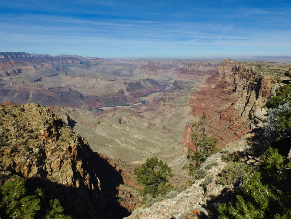 Painting of canyon landscape with cliffs and clouds