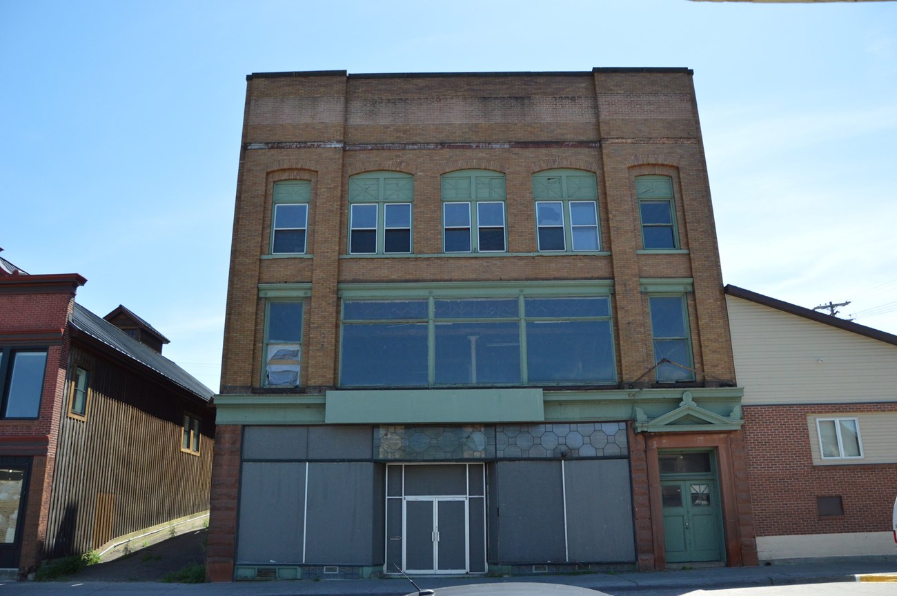 A historic black and white photo of the Oldfellows building in Calumet, MI