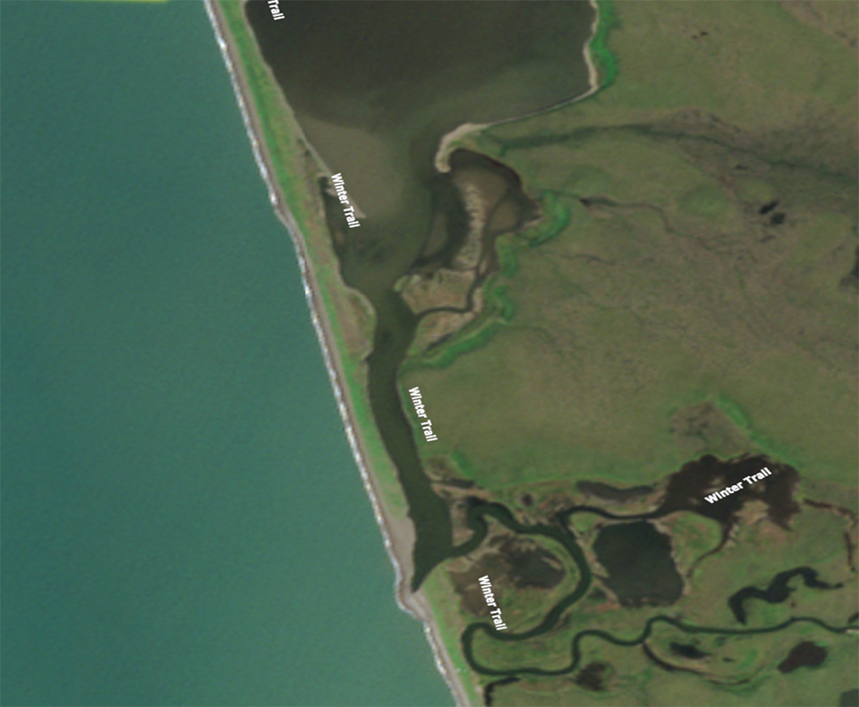 Satellite image of a lagoon in June with sea ice on the ocean