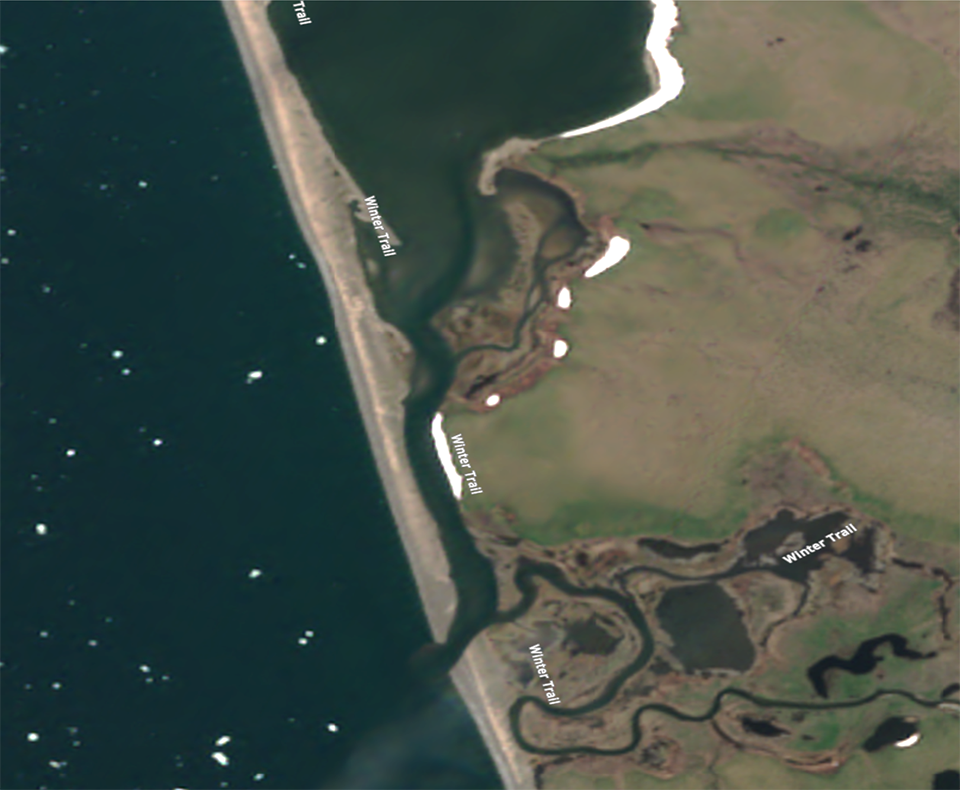 Satellite image of a lagoon in June with sea ice on the ocean