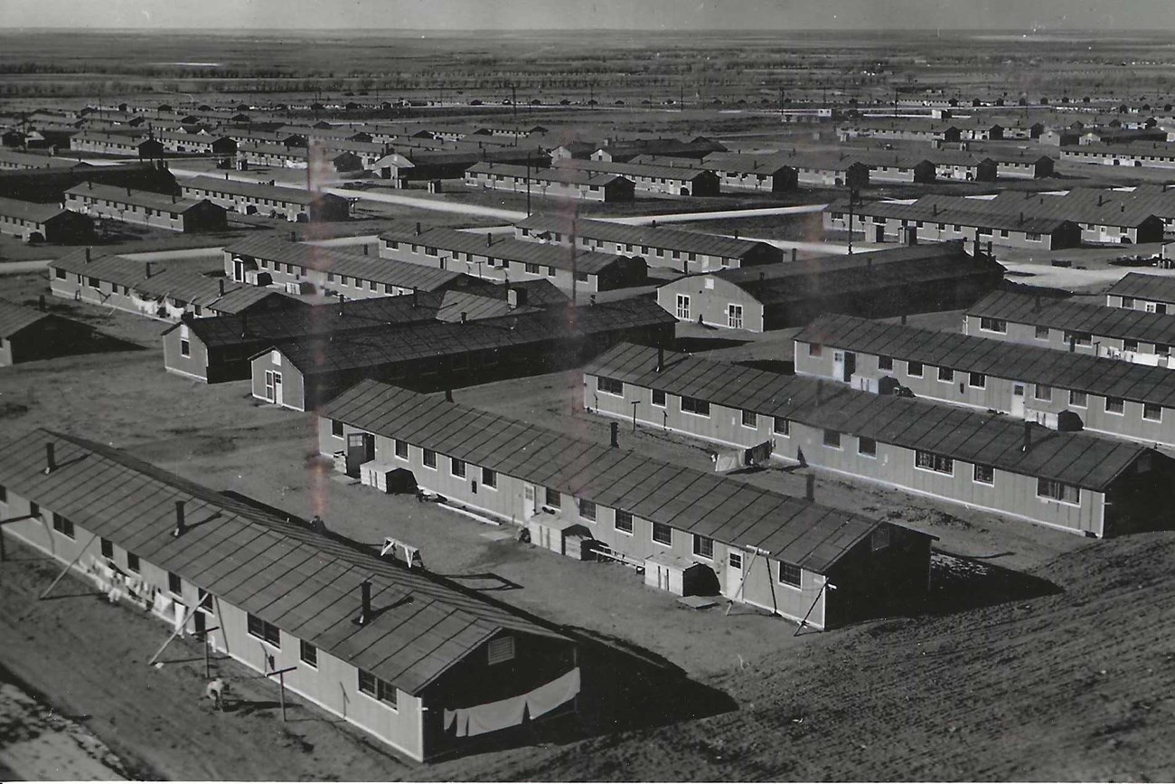 Overhead view of many barracks laid out in rows.