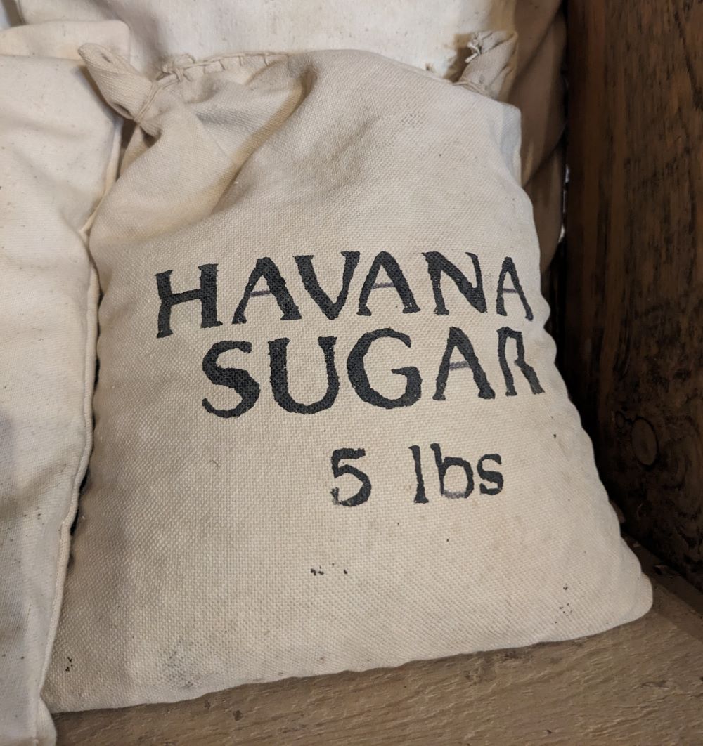 A beige canvas bag stamped 