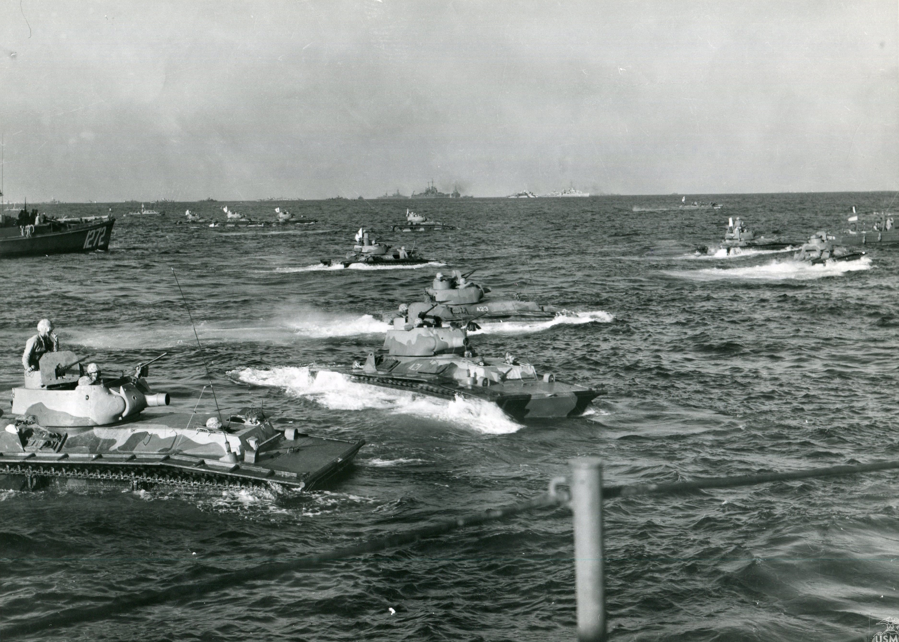 Troops in military gear crouch in a landing craft approaching a beach, exuding courage and tension. Ocean waves and another boat are visible.