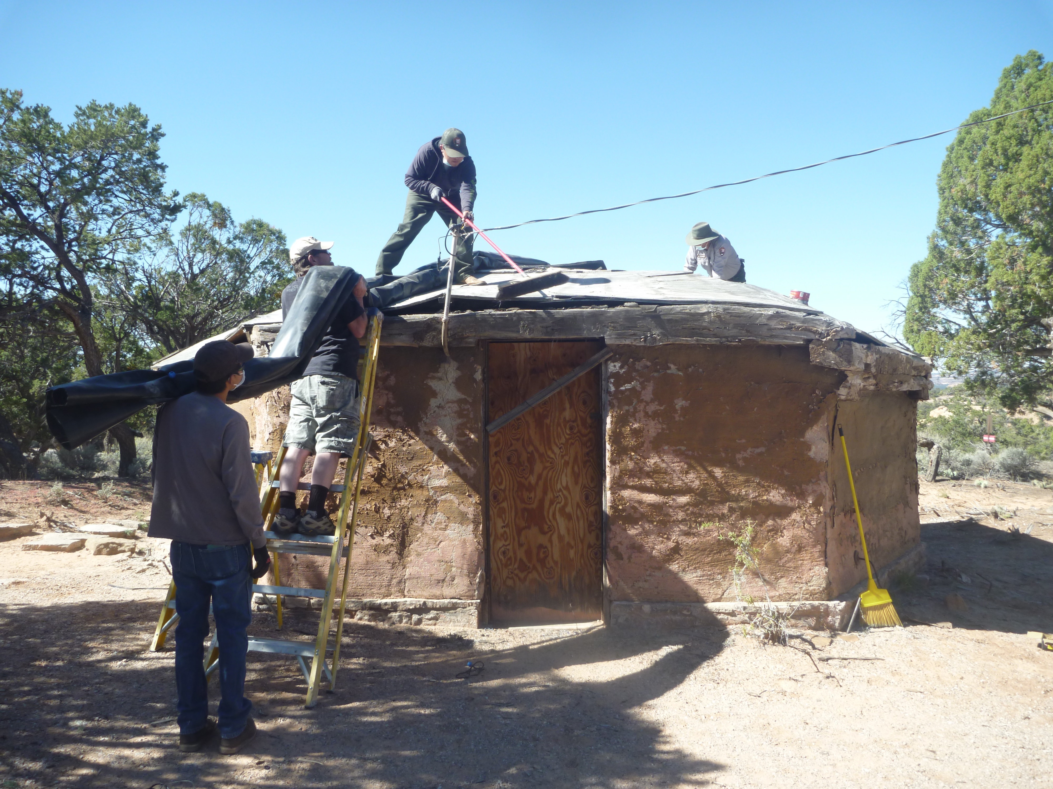 Hogan under construction with workers.