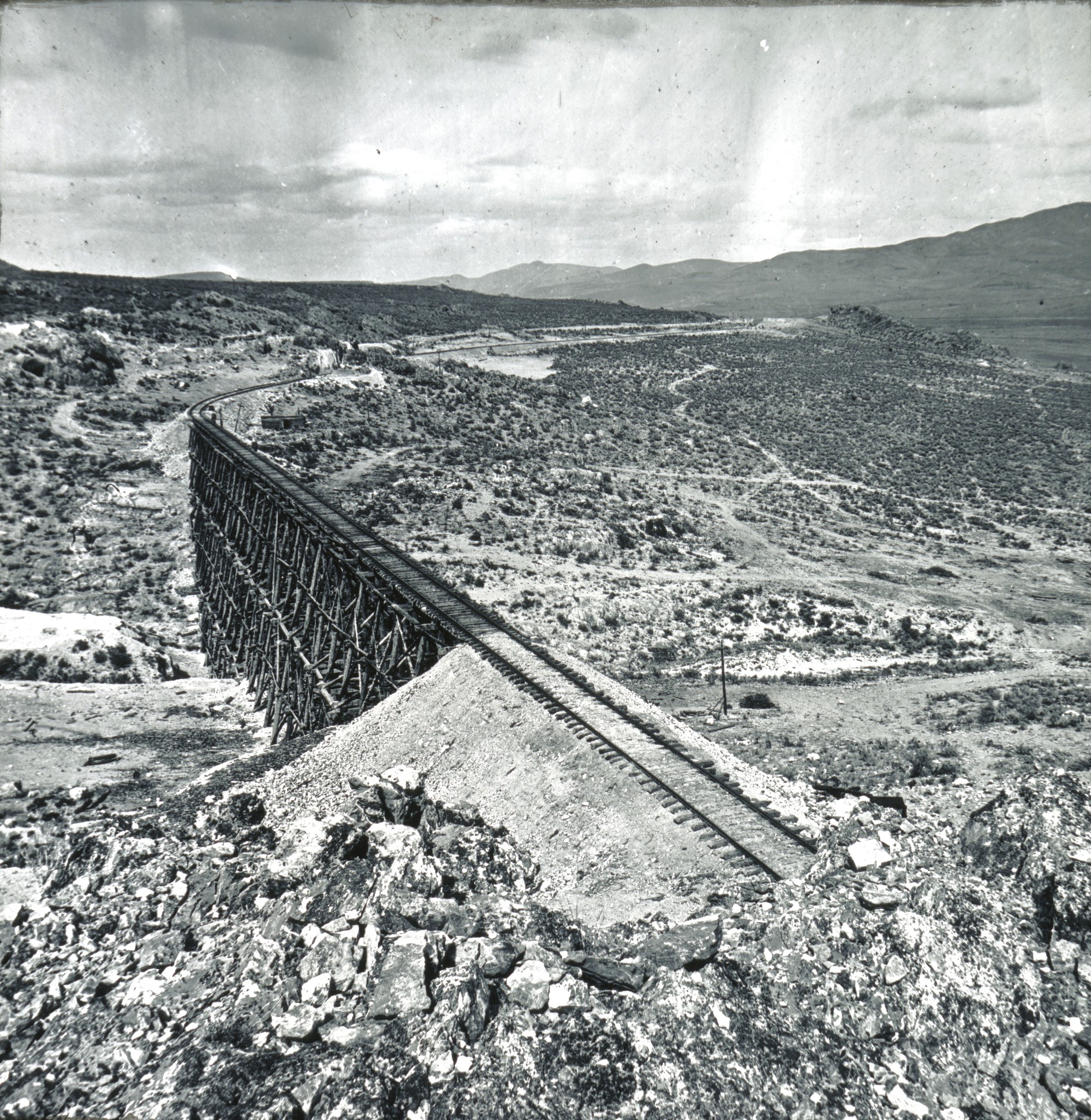Historic railroad trestle spans a broad desert valley in northern Utah