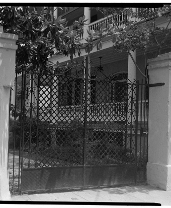 Property gate with house in background. 