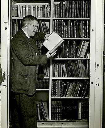 Harry Dana reading a book in the Study vault of the Longfellow House