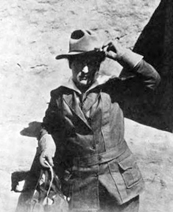 Willa Cather in a hat and jacket at Mesa Verde. Public domain.