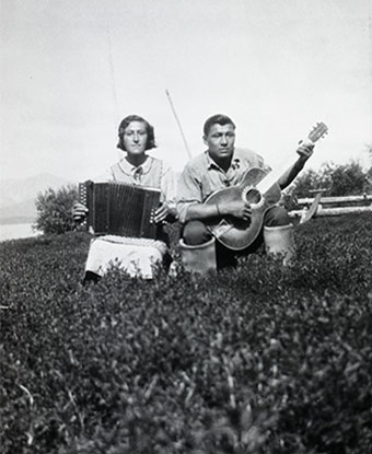 Woman and man playing musical instruments.