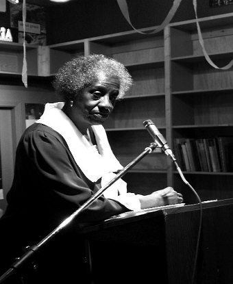 black woman at a podium