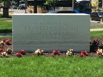 A rectangular block of marble with the words, 