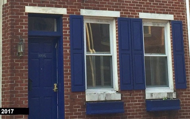 Frances Ellen Watkins Harper House made of brick with navy blue shutters. 