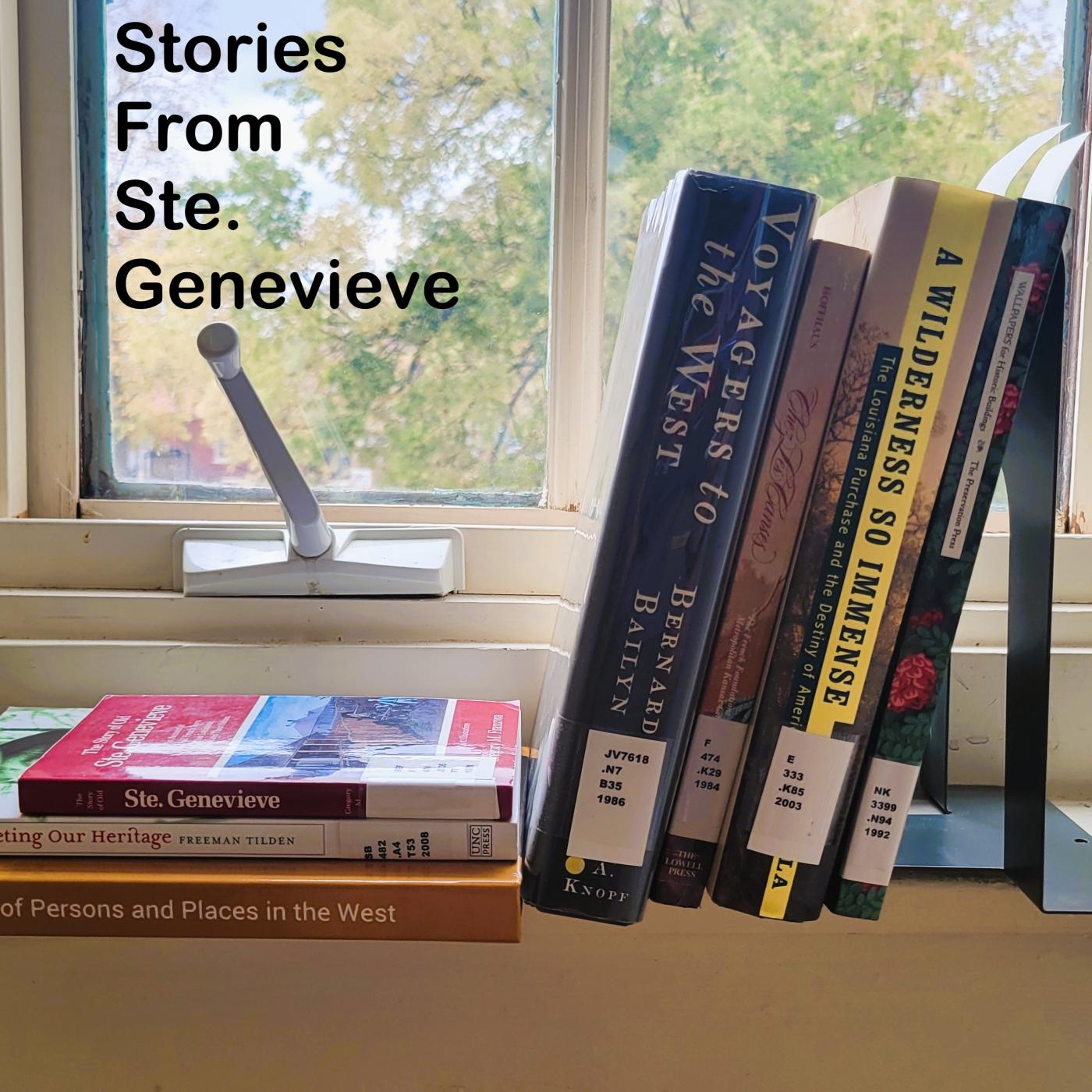 3 books stacked against 4 other books places on a windowsill, with a tree beyond the window.