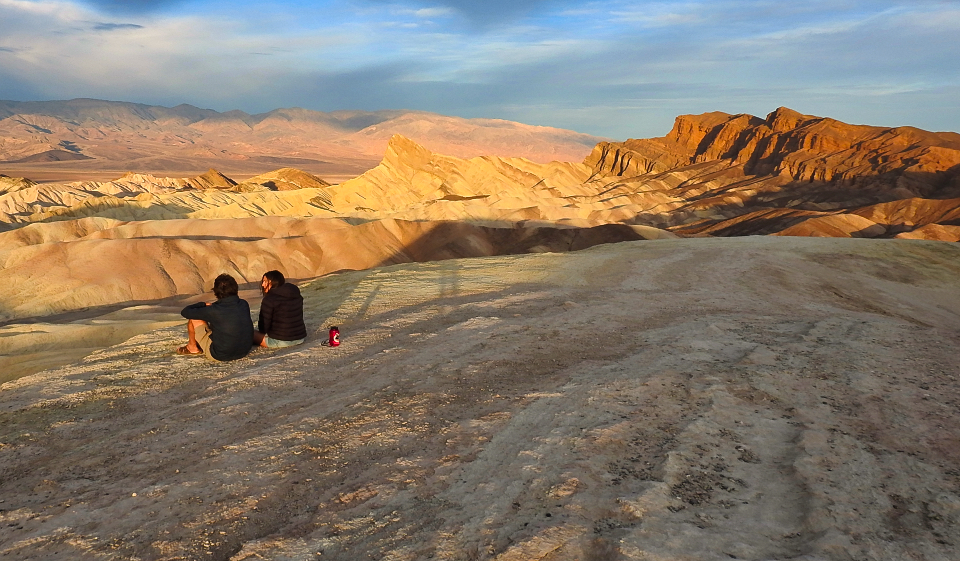 Painting of three people and a dog with sneakers on.