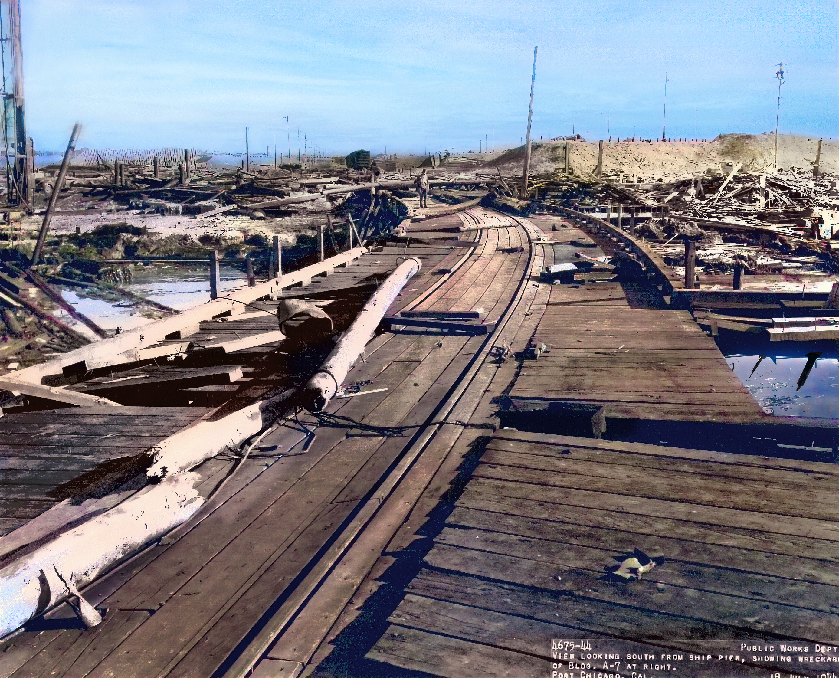 Historic Black and white photo of the disaster aftermath. Railroad tracks and debris.