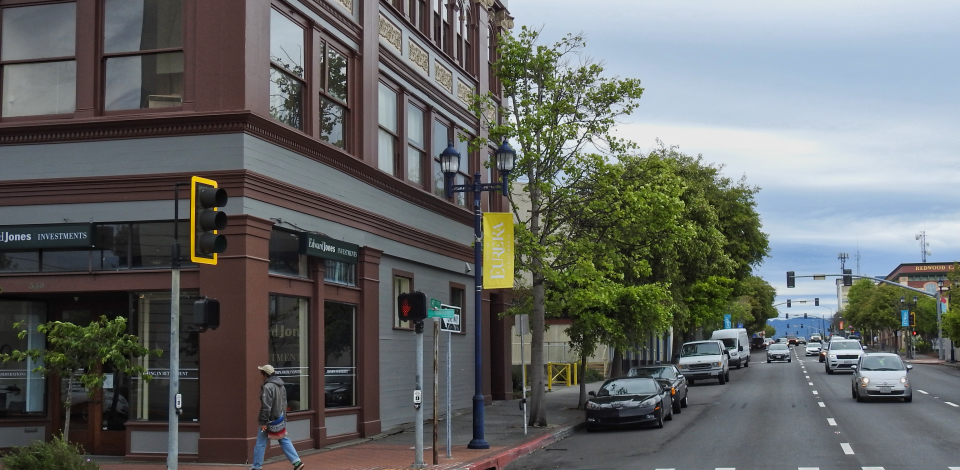 Buildings along street with man standing