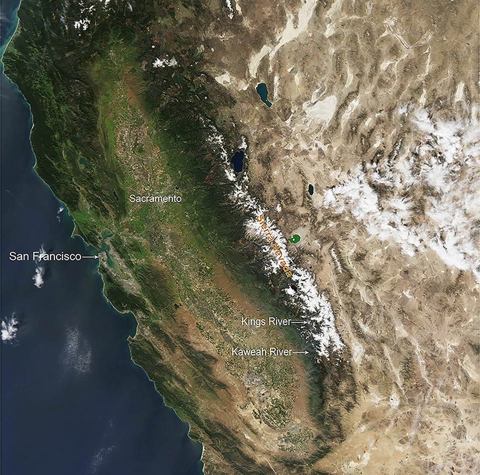 Aerial image shows view of an average year of snowpack (2010) in the Sierra Nevada, with snow covering middle to upper elevations across the Sierra Nevada.