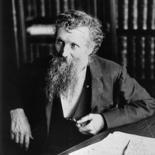 John Muir at a writing desk, black and white photo