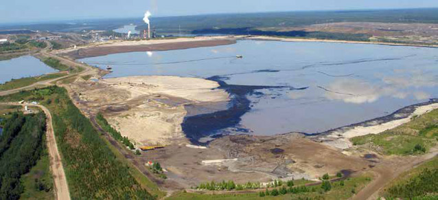 aerial view of a large pond surrounded by dirt roads