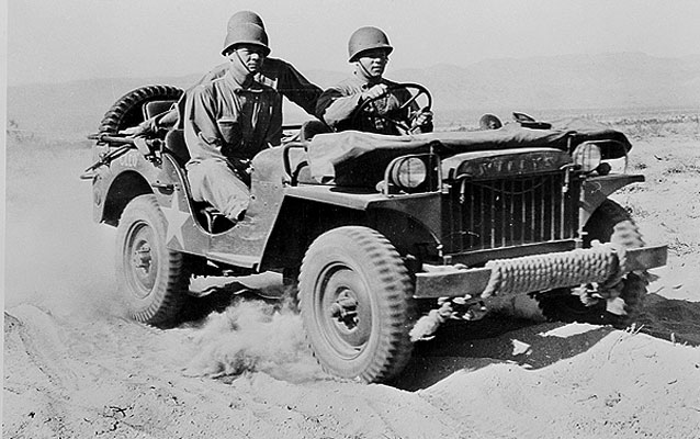Indio, California. A half-ton jeep rolling over the desert at the desert training center June 1942