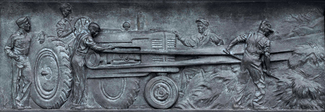 Brass relief of farmers harvesting wheat
