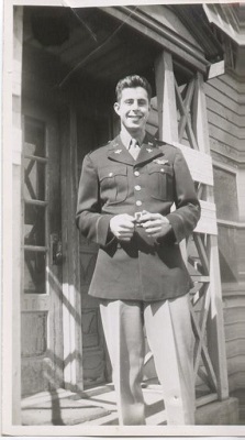 A man in uniform poses for a photo