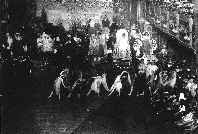 Inside the Webster dance hall in the 1920s, with an audience watching costumed performers