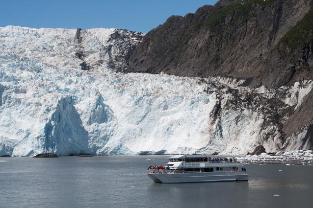 a large boat near a tidewater glacier