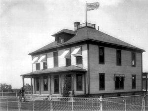 Black and white photo of a house office building 