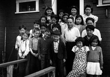 black and white photograph of 21 school children
