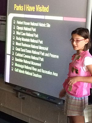 Talia, in her famous pink Jr Ranger vest, shares her experiences to her classmates