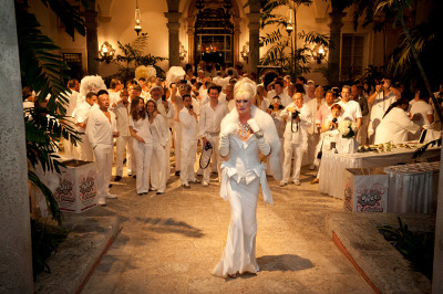 Party-goers dressed in white attend the annual White Party Week at the Vizcaya Villa