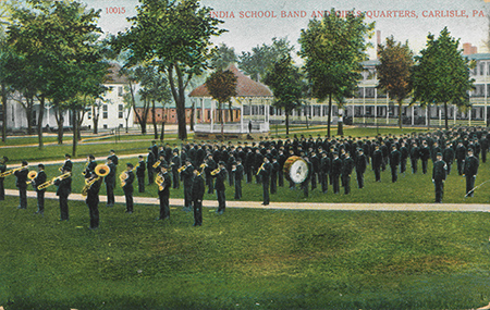 Student marching band playing on a field