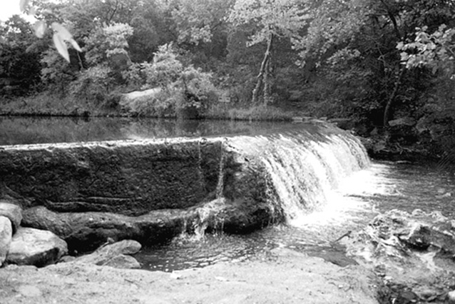 Water cascades over a low concrete dam at Panther Falls, circa 1999 