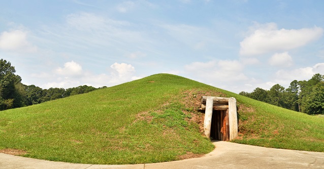 Earthen mound with a door
