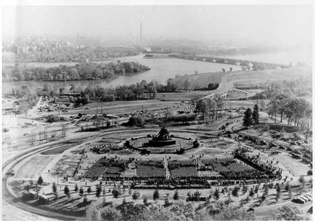 Aerial view shows monument at center and surrounding landscape features
