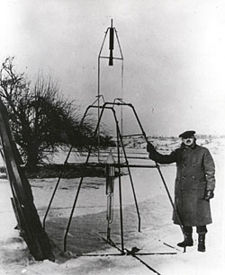 Dr. Robert H. Goddard and a liquid oxygen-gasoline rocket