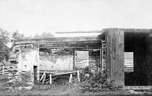 The stone building in ruins. 