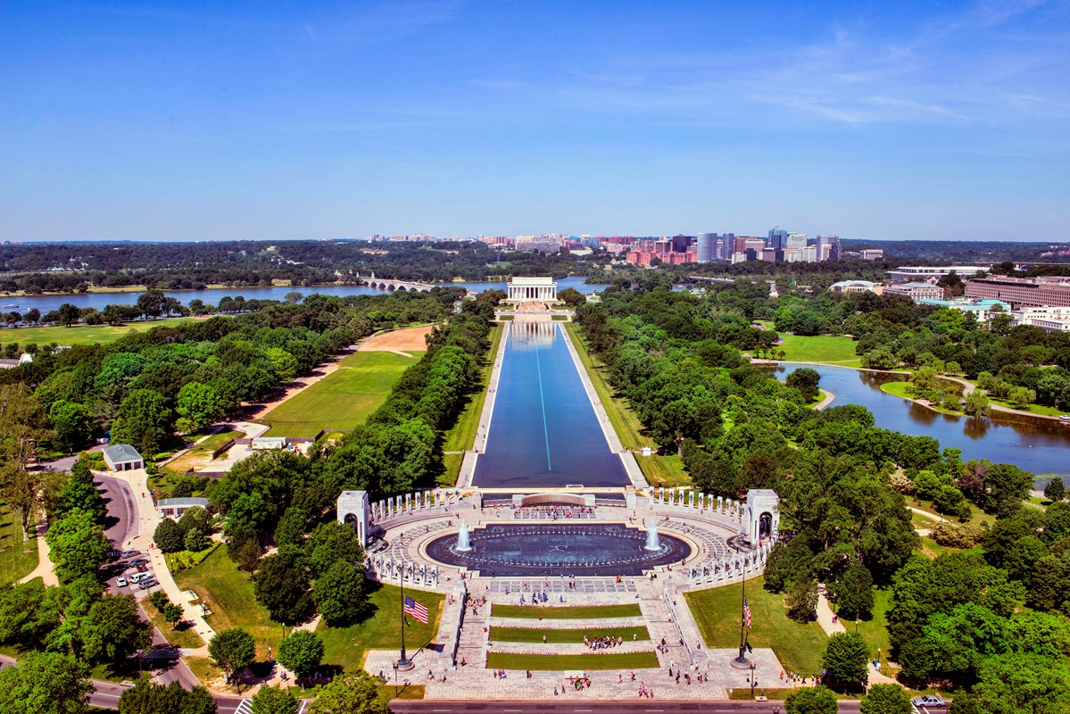 Aerial view of stone columns around an oval-shaped pool at the World War II Memorial.