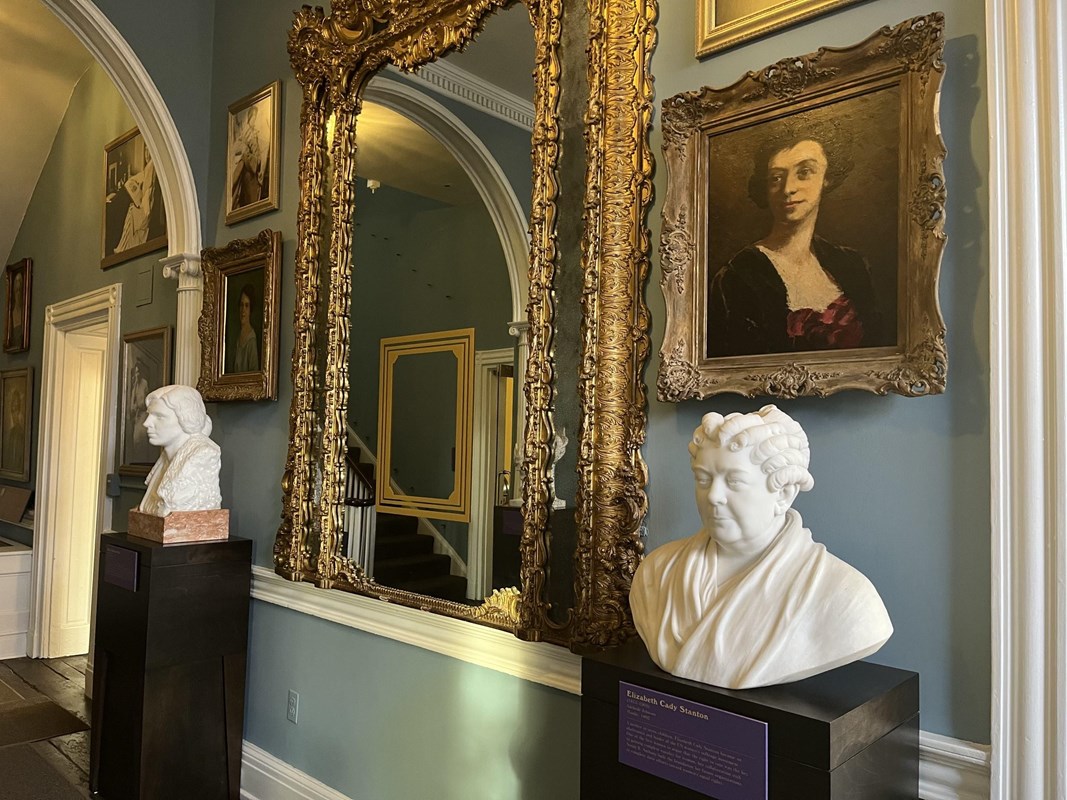 Belmont-Paul entrance hallway large gilded center mirror with busts on pedestals on each side