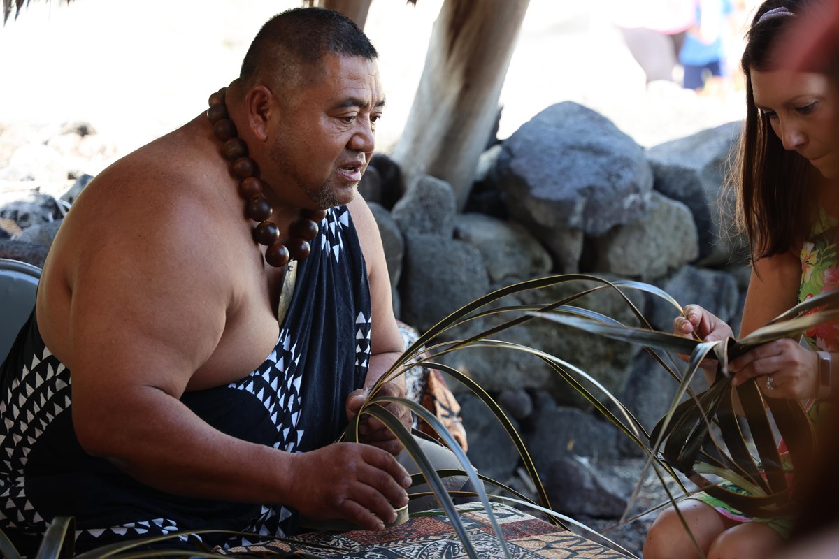 Man demonstrating Hawaiian craft